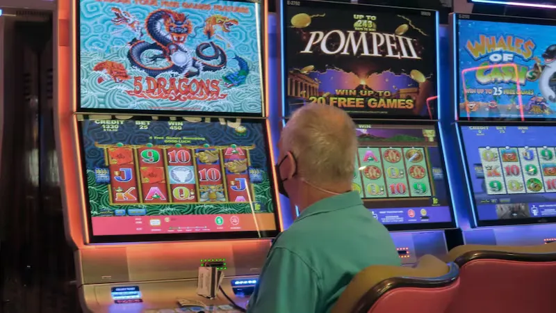 Focused Bangladeshi player immersed in vibrant, high-definition slot action inside the premium 8JJBET lobby.